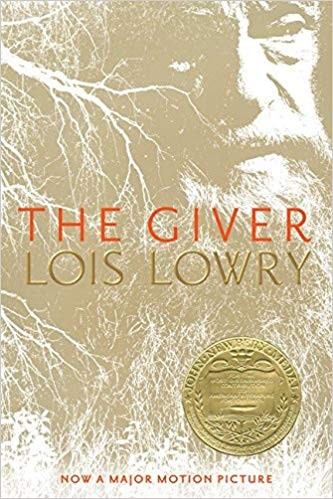 Cover of the Houghton Mifflin paperback edition of The Giver by Lois Lowry, showing the close-up black and white photograph of an elderly bearded man's face